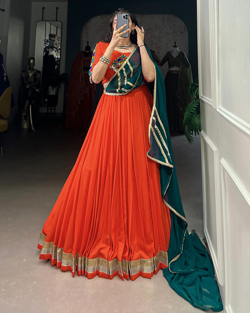 Orange Color Rayon Embossed Navratri Lehenga Choli - ETHNICDEAL
