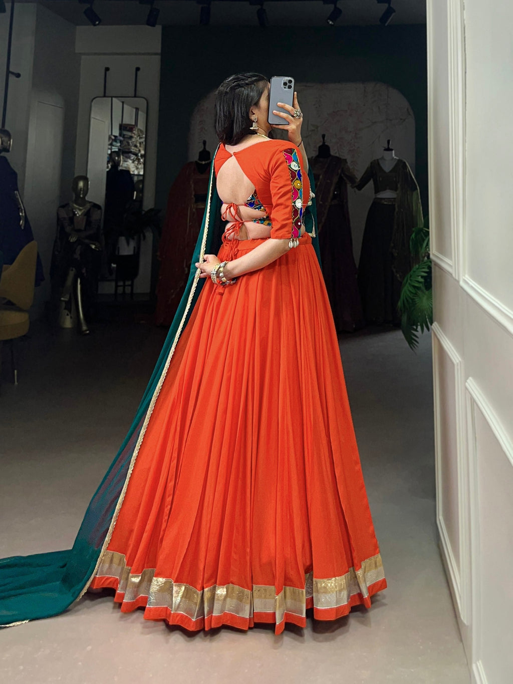 Magnificent Orange Pure Rayon Embossed Navratri Lehenga Choli - ETHNICDEAL