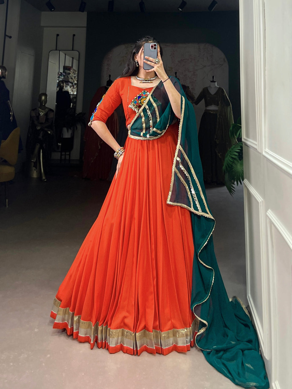 Magnificent Orange Pure Rayon Embossed Navratri Lehenga Choli - ETHNICDEAL